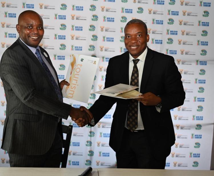 Director General of South Africa Department of Tourism Mr.Nkhumeleni Victor Vele, Director General of the South African Presenting Gift to Tourism Secretary David Gitonga Department of TourismNkhumeleni Victor Vele, Director General of the South African Department of Tourism to
