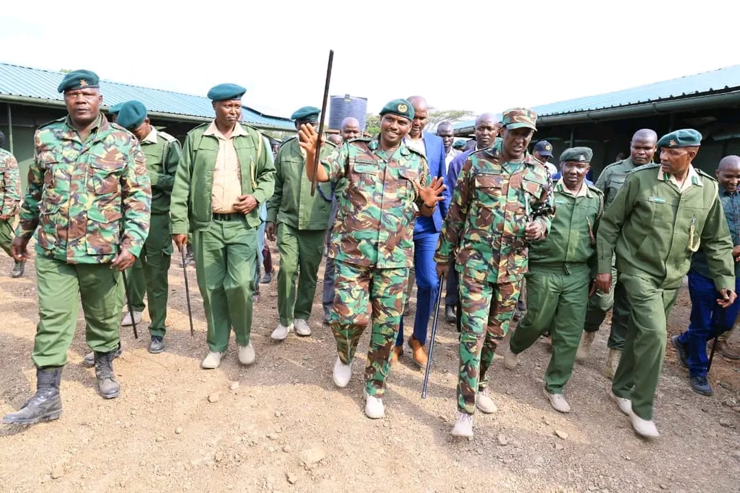 Maasai Mara game reserve Chief Game Warden Steven Minis (gesturing with a swagger stick in his hand) takes Narok County Governor Patrick Ole Ntutu (in jungle suit in his left)on a tour of the rangers station at Sekenani gate in Narok during occasion to mark World Rangers' Day.