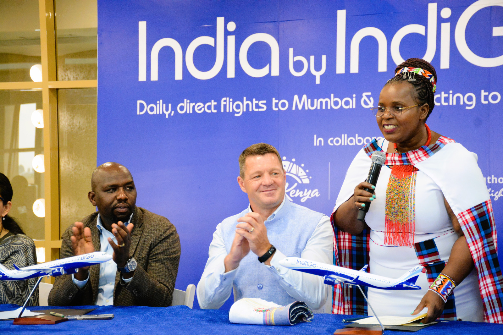(Left to right): The Cabinet Secretary for Roads and Transport, Hon. Kipchumba Murkomen, and the Chief Executive Officer of IndiGo Air, Mr. Pieter Elbers, listen on as the Cabinet Secretary for Tourism, Wildlife, and Heritage, Hon. Peninah Malonza, addresses the media.