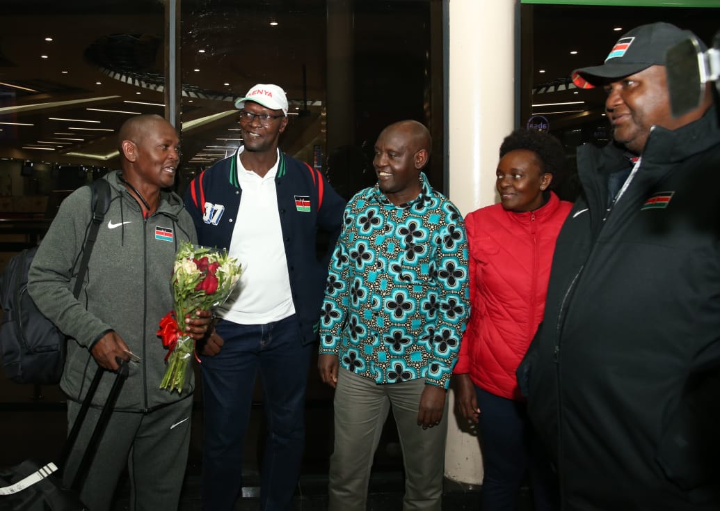 PS Tourism, John Ololtuaa (in a flowered shirt) with the National Olympic Committee of Kenya officials while receiving the Kenya Team to the country from the Common Wealth Youth Games which were held in Trinidad and Tobago.