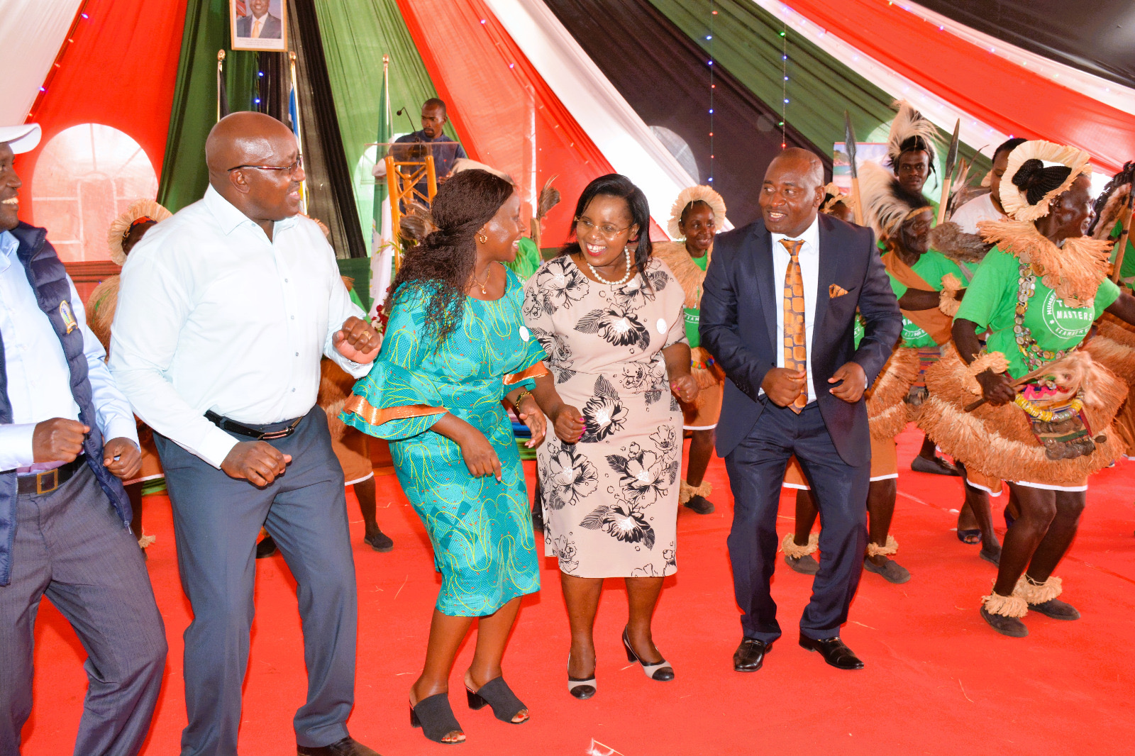 he Cabinet Secretary, Hon. Peninah Malonza (4th from left), is joined by the Governor of Embu County, Her Excellency Cecily Mbarire (3rd from left), and the Principal Secretary State Department for Tourism, Hon. John Ololtuaa, in a cultural dance during the World Tourism Day celebrations.
