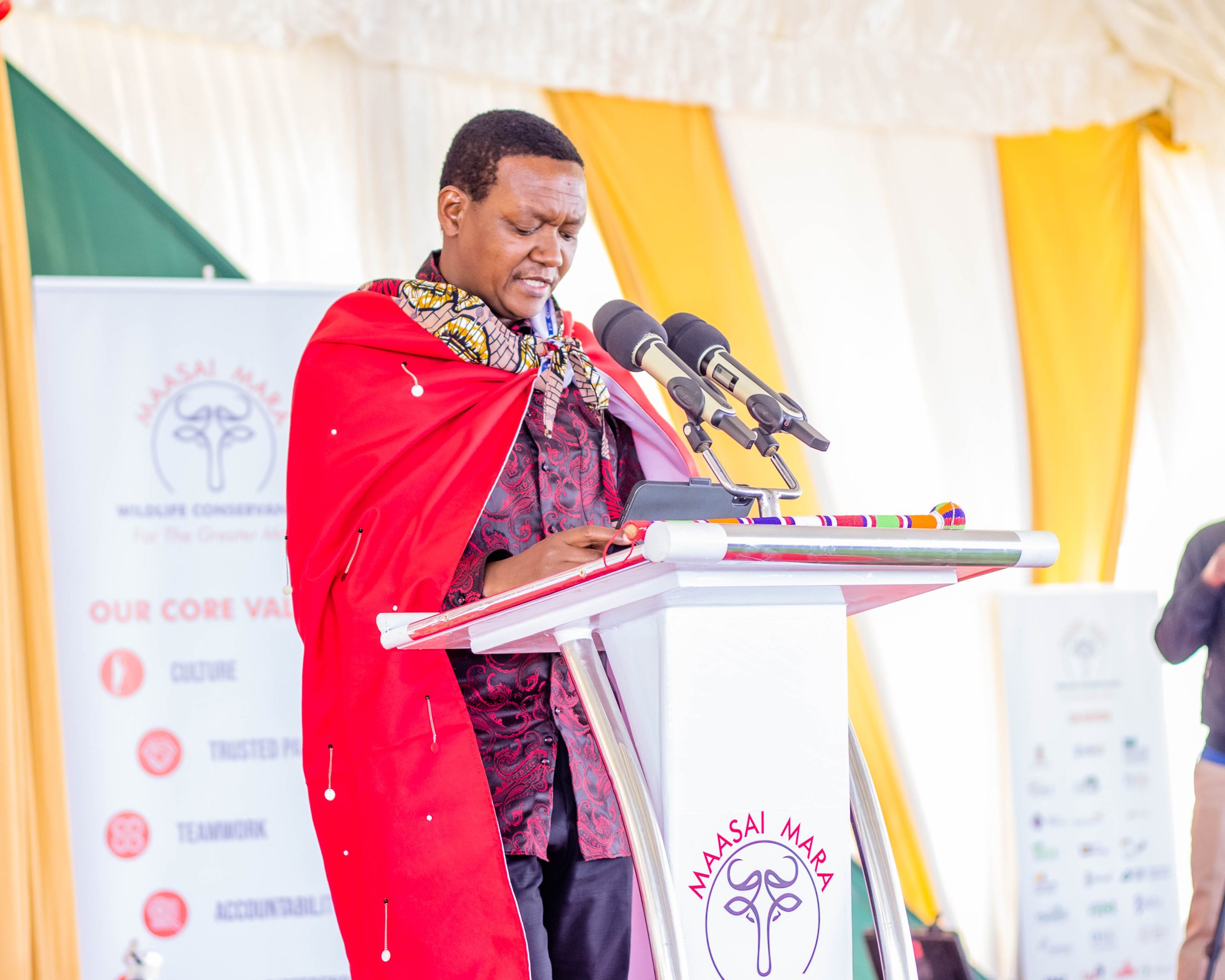 The Cabinet Secretary for Tourism and Wildlife, Dr. Alfred Mutua, giving his speech during the 10th anniversary of the Maasai Mara Wildlife Conservancies, in Narok County.