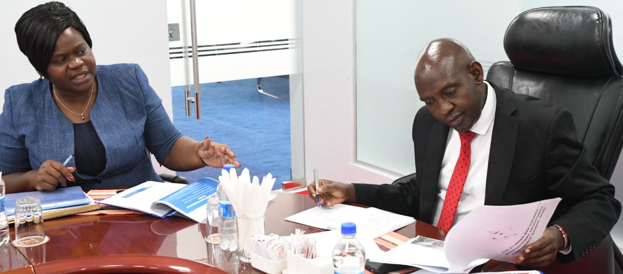 Governor Gladys Wanga (L) with PS John Ololtuaa (R) in a meeting at the PSs office