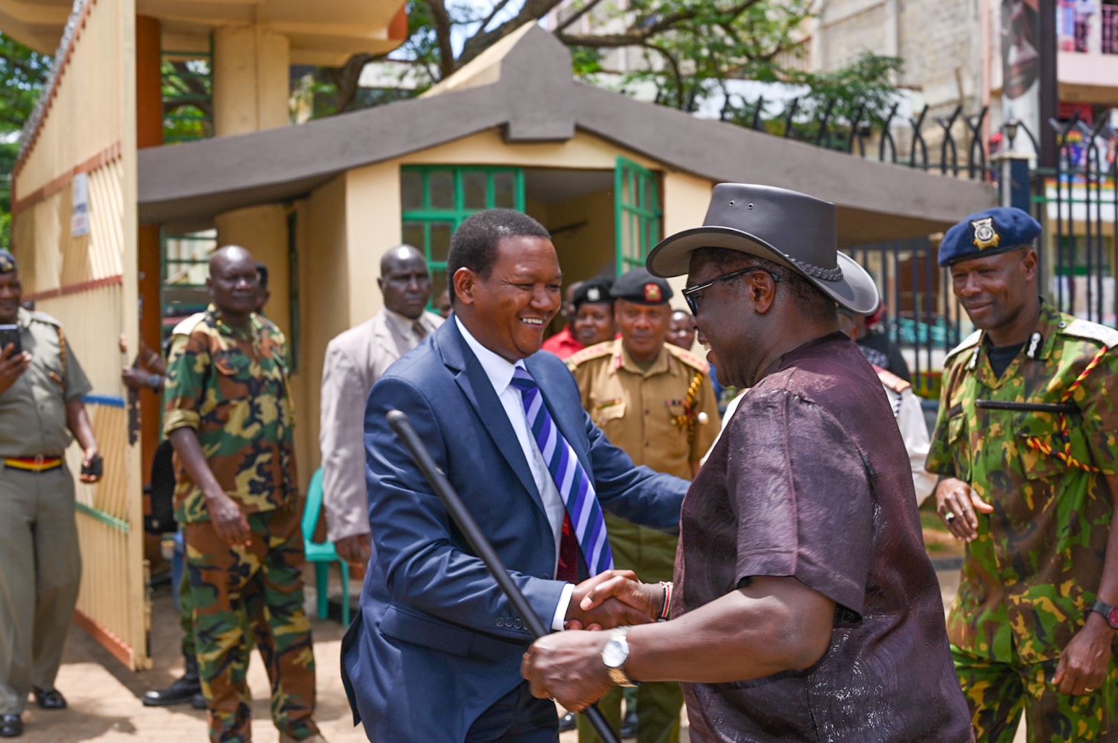 The Cabinet Secretary, Ministry of Tourism and Wildlife, Dr. Alfred Mutua (in navy blue suit) being welcomed by the Governor of Bungoma County, H.E. Rt. Hon. Kenneth Lusaka (wearing a hat).