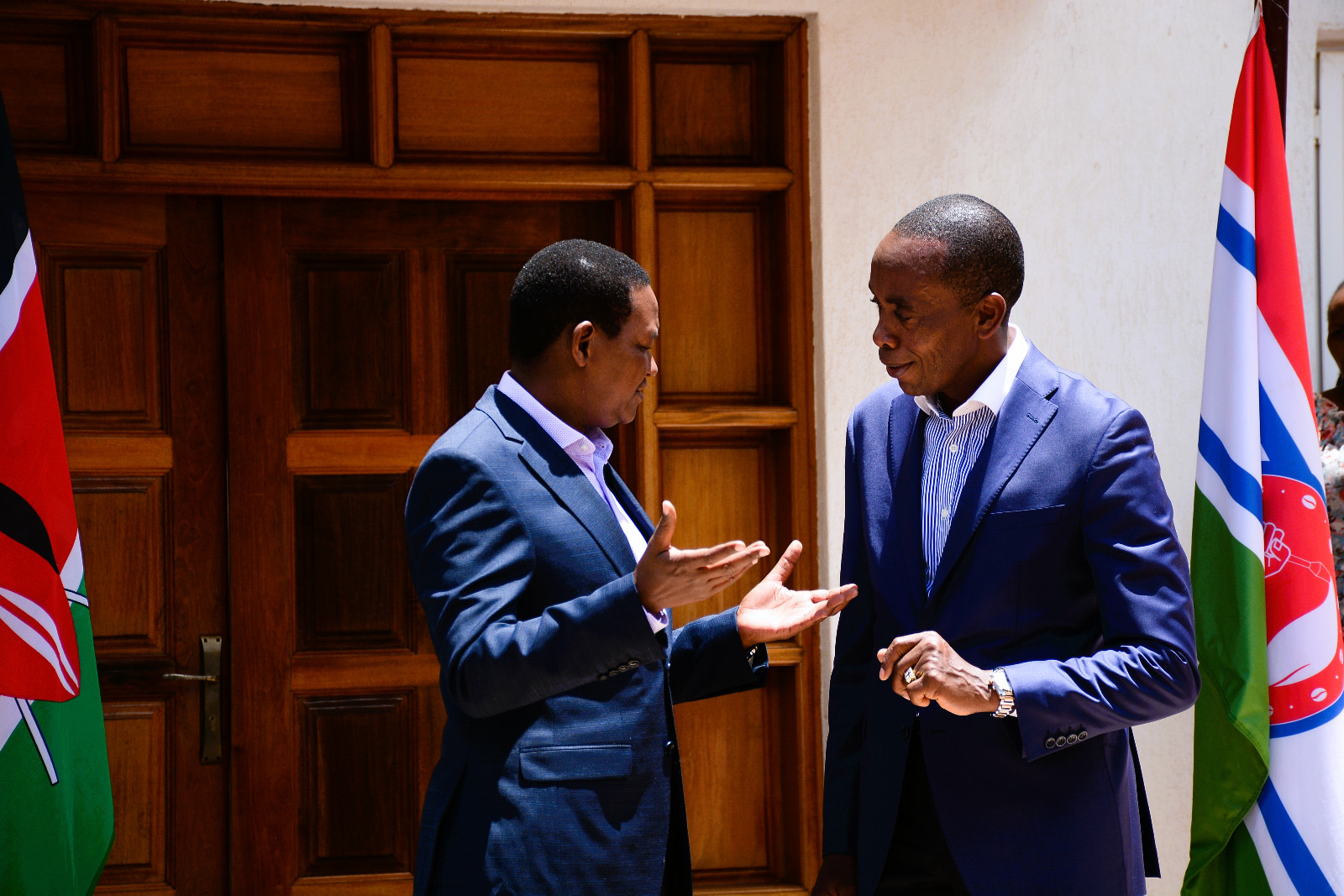 The Cabinet Secretary, Ministry of Tourism and Wildlife, Dr. Alfred Mutua (left), having a conversation with the Kiambu County Governor, H.E. Dr. Paul Wamatangi (right).