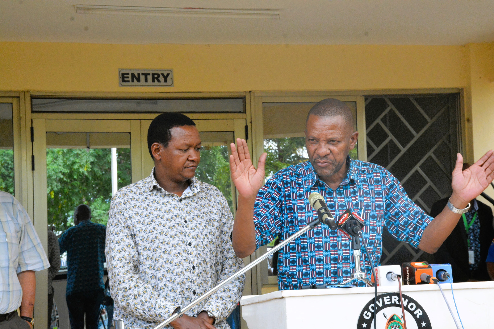 The Governor of Taita Taveta, H.E. Andrew Mwadime (right) addressing the media.