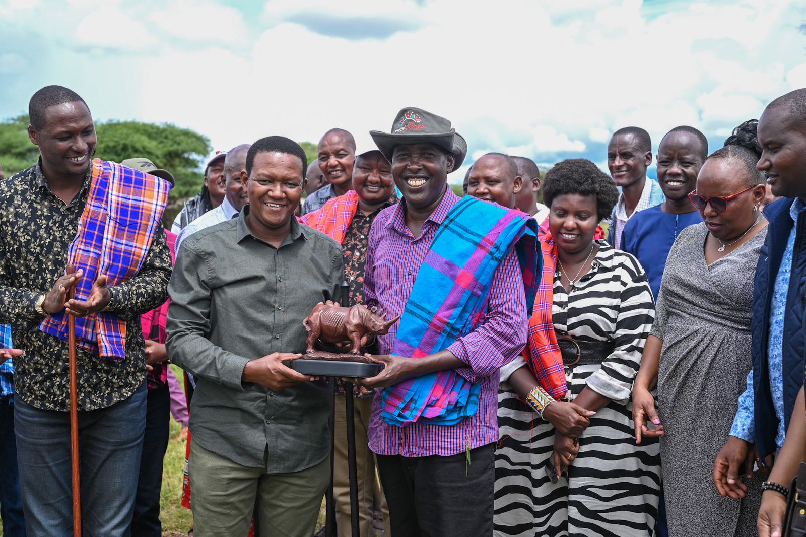 CS Mutua posing for a photo with Kajiado County governor, Joseph Ole Lenku.