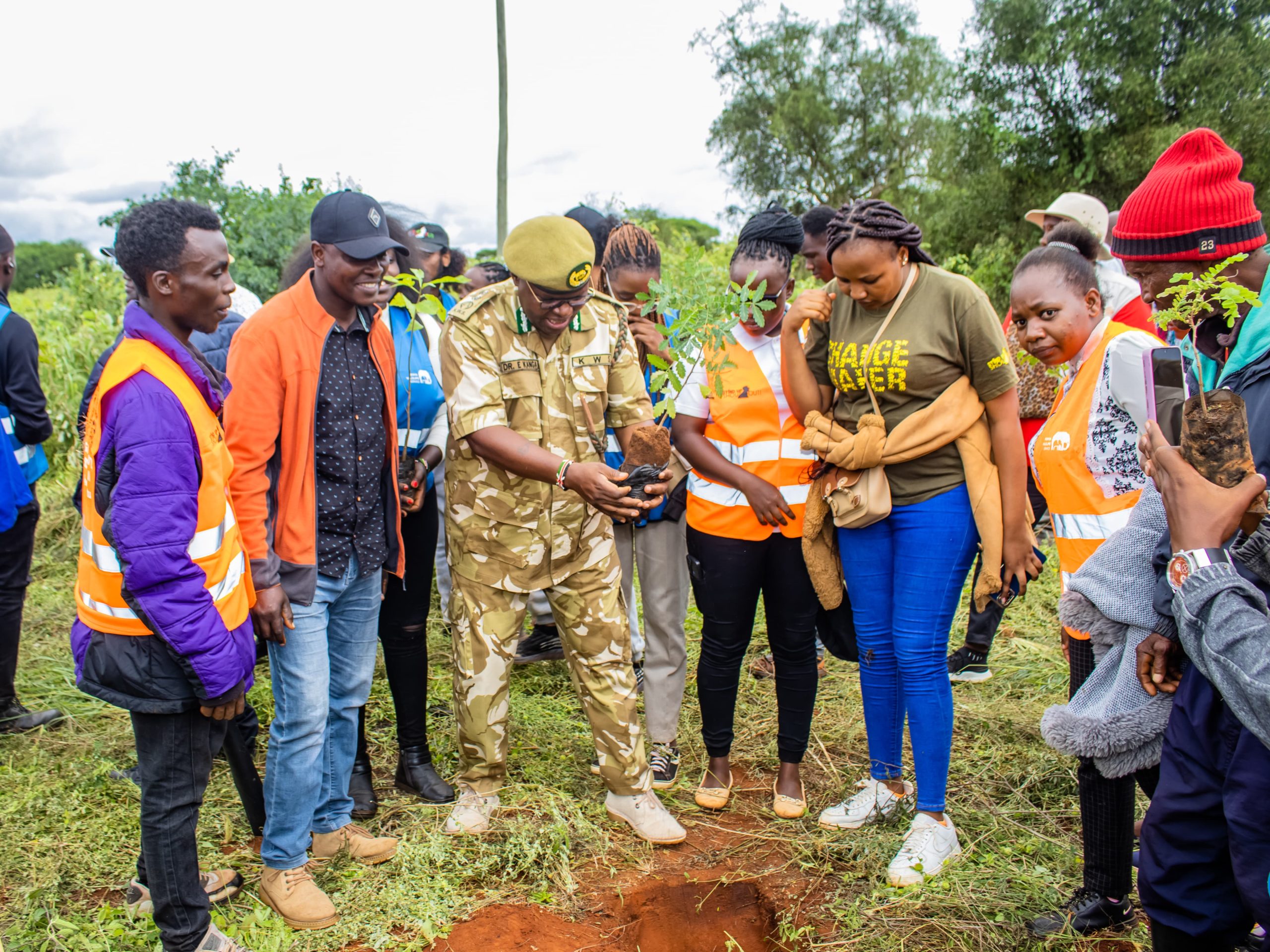Ministry staff and personnel from associated parastatals in a tree-planting exercise within the Lumo Community Wildlife Conservancy